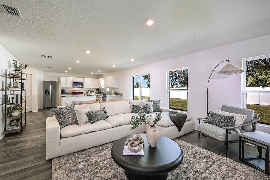 A living room with a couch and coffee table. A living room with a couch and coffee table.