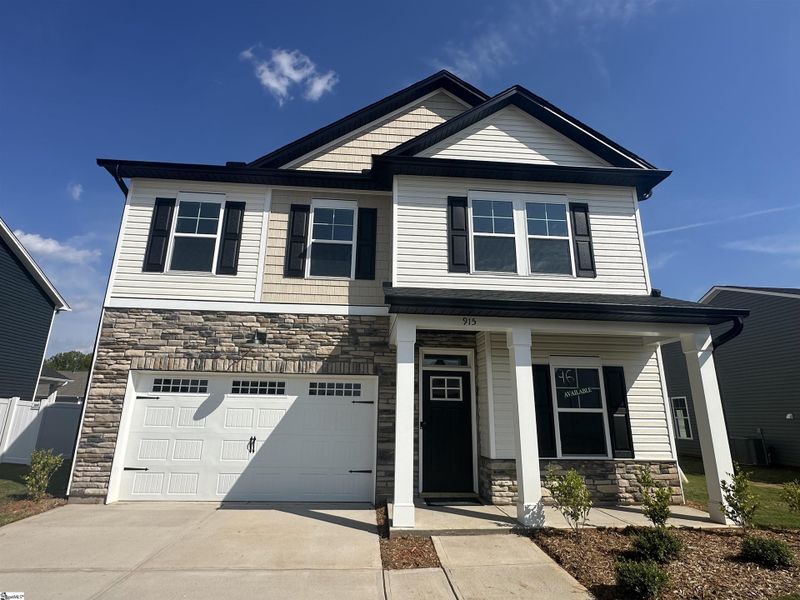 Front exterior of a new home in Shiloh Trail, Wellford, SC, highlighting curb appeal (Image 21).