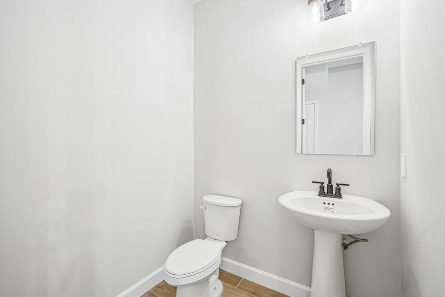 Half bathroom is located off the kitchen near the garage Half bathroom is located off the kitchen near the garage