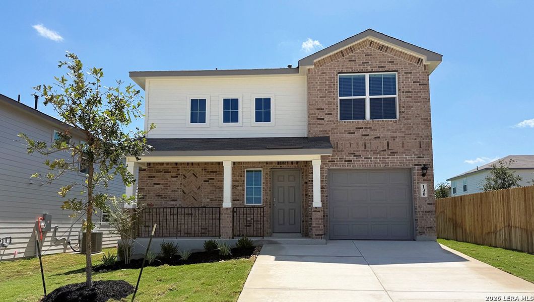 Front exterior of a new home in Redbird Ranch, San Antonio, TX, highlighting curb appeal (Image 2).