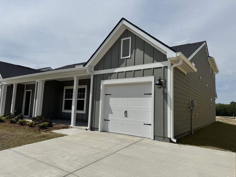 Front exterior of a new home in , Ravenel, SC, highlighting curb appeal (Image 15).