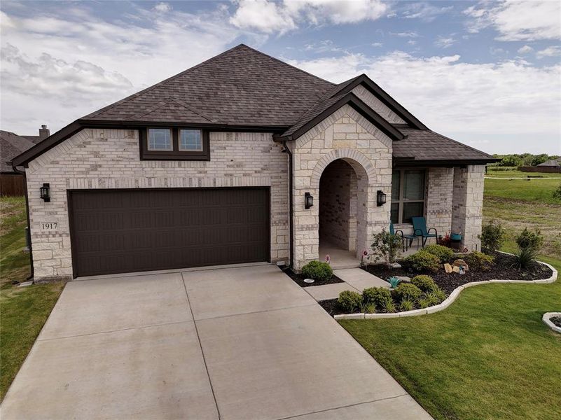 Front exterior of a new home in , Venus, TX, highlighting curb appeal (Image 20).