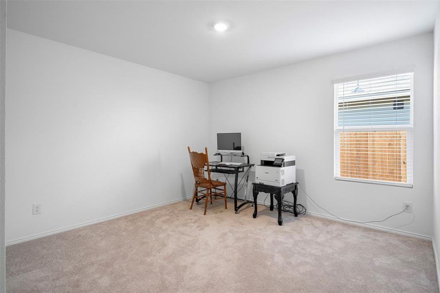 Office with light colored carpet and baseboards Office with light colored carpet and baseboards