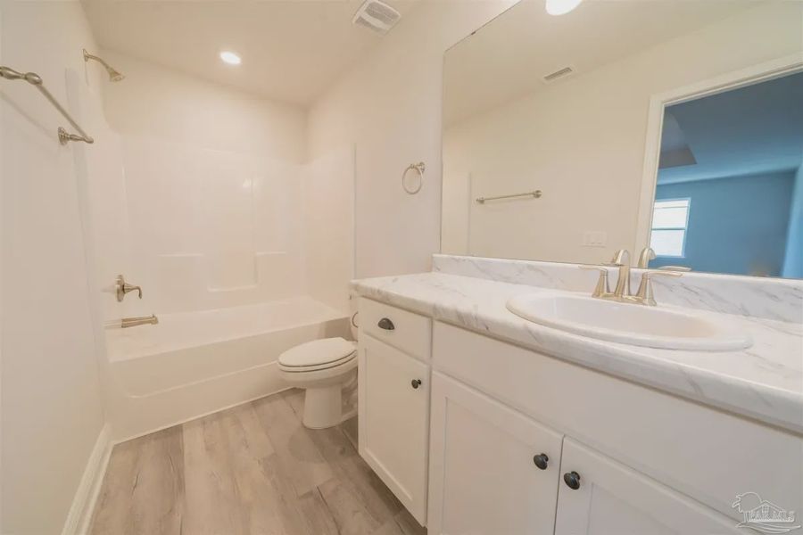 Representative unfurnished interior of a home built from the Plan 1645 by Adams Homes in Westpointe Place, Pensacola (Image 9).