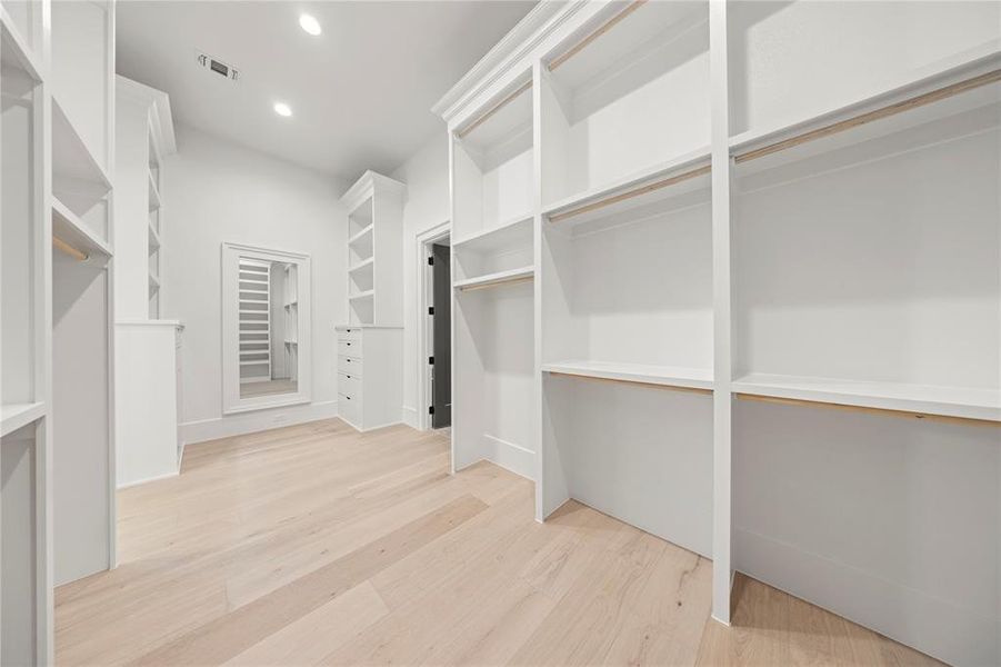 Walk in closet featuring light wood-type flooring