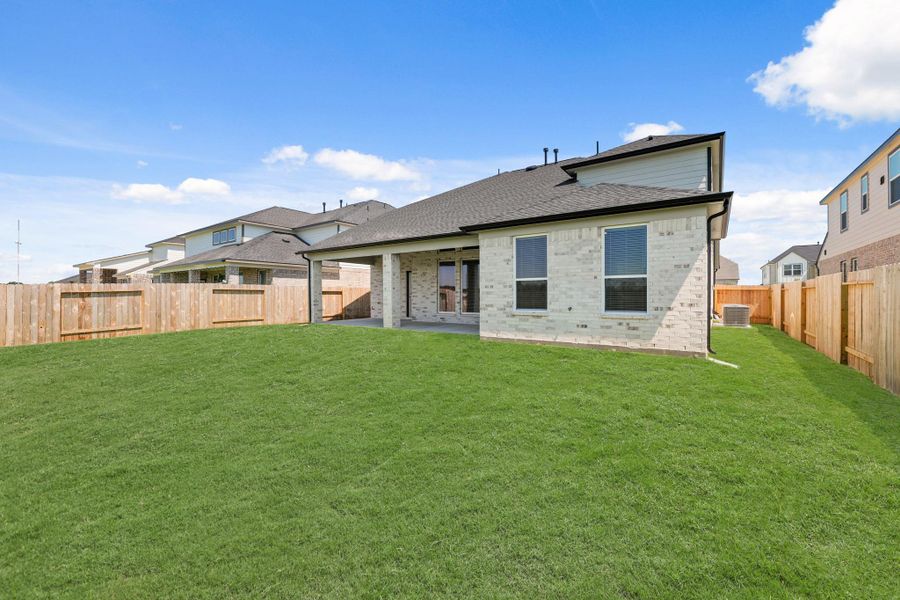 Front exterior of a new home in Briarwood Crossing, Rosenberg, TX, highlighting curb appeal (Image 2).
