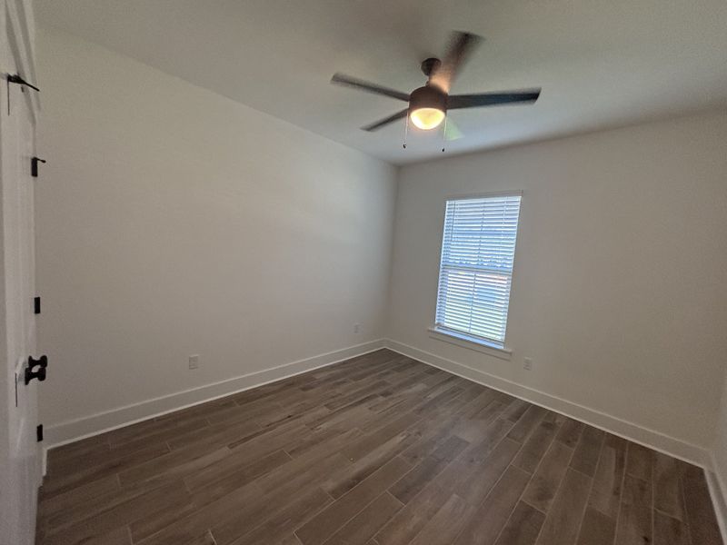 Spacious, unfurnished interior of a new home in Bird Song at Hammock Bay, Freeport (Image 25).