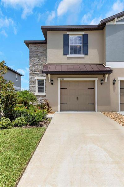 Front exterior of a new home in , Land O' Lakes, FL, highlighting curb appeal (Image 20).