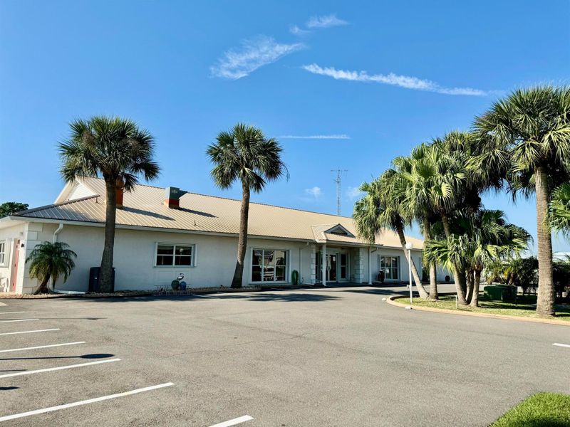 Front exterior of a new home in , Okeechobee, FL, highlighting curb appeal (Image 21).