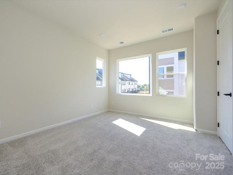 Primary suite bathed in natural light.