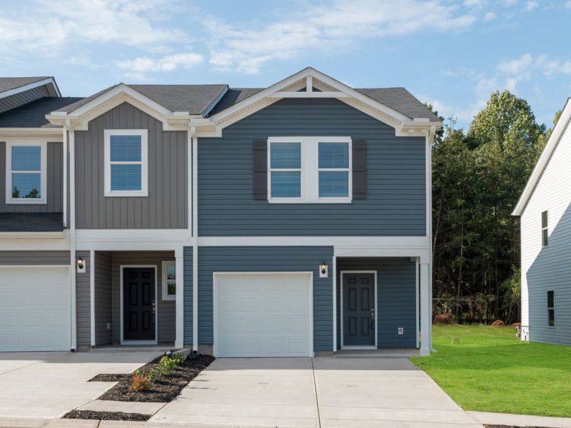 Front exterior of a new home in Avalon Townes, Lyman, SC, highlighting curb appeal (Image 1).
