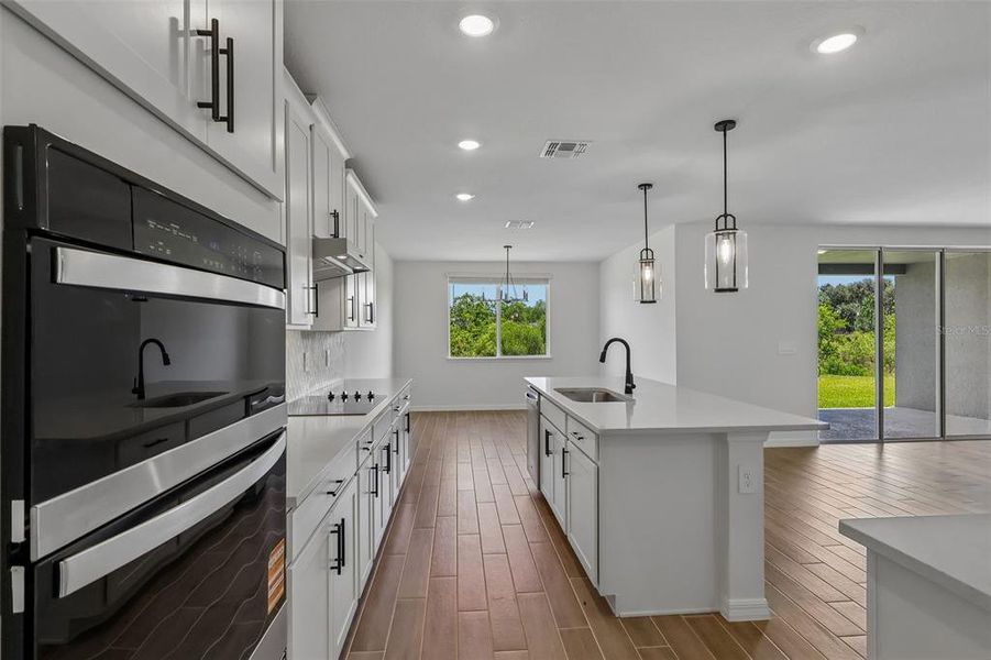 Furnished interior view inside a new home in The Grove at Stuart Crossing - Signature Series, Bartow (Image 11).