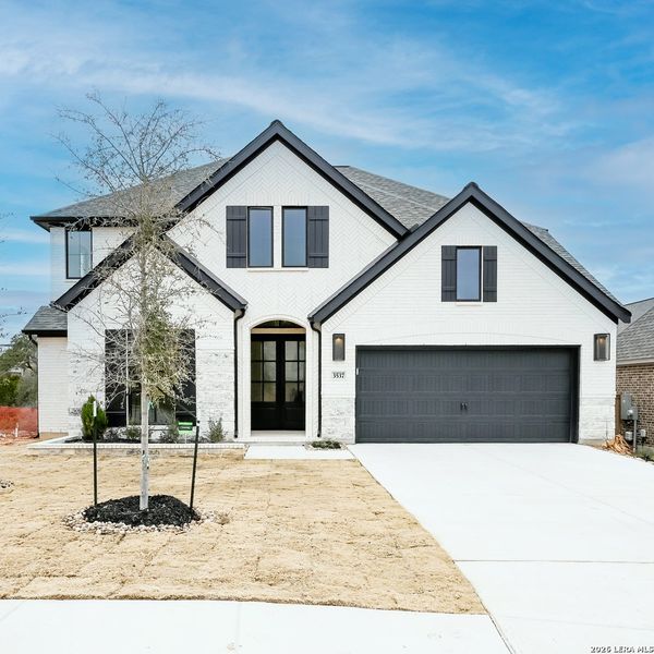 Front exterior of a new home in Johnson Ranch, Bulverde, TX, highlighting curb appeal (Image 22).