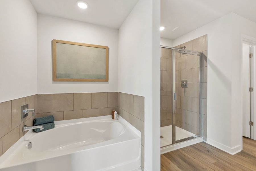 A bathroom with a glass shower. A bathroom with a glass shower.