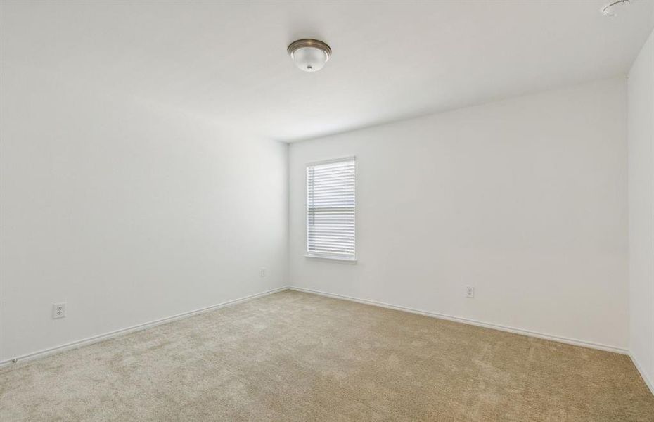 Spacious secondary bedroom with ample closet space  *real home pictured