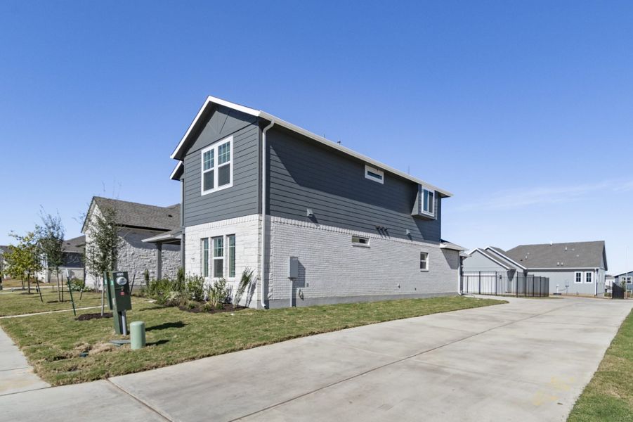 Front exterior of a new home in Easton Park, Austin, TX, highlighting curb appeal (Image 28).