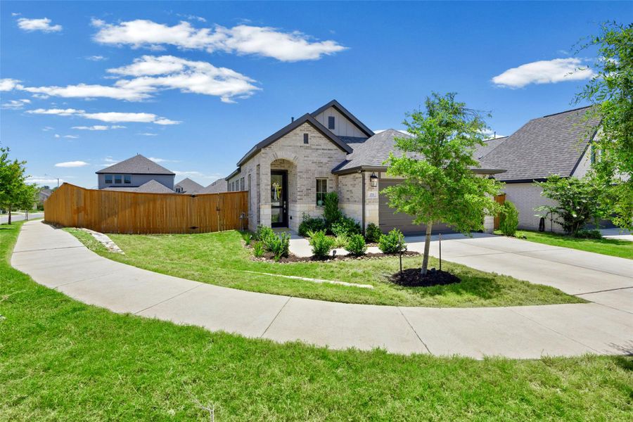 Front exterior of a new home in , Kyle, TX, highlighting curb appeal (Image 2). Front exterior of a new home in , Kyle, TX, highlighting curb appeal (Image 2).