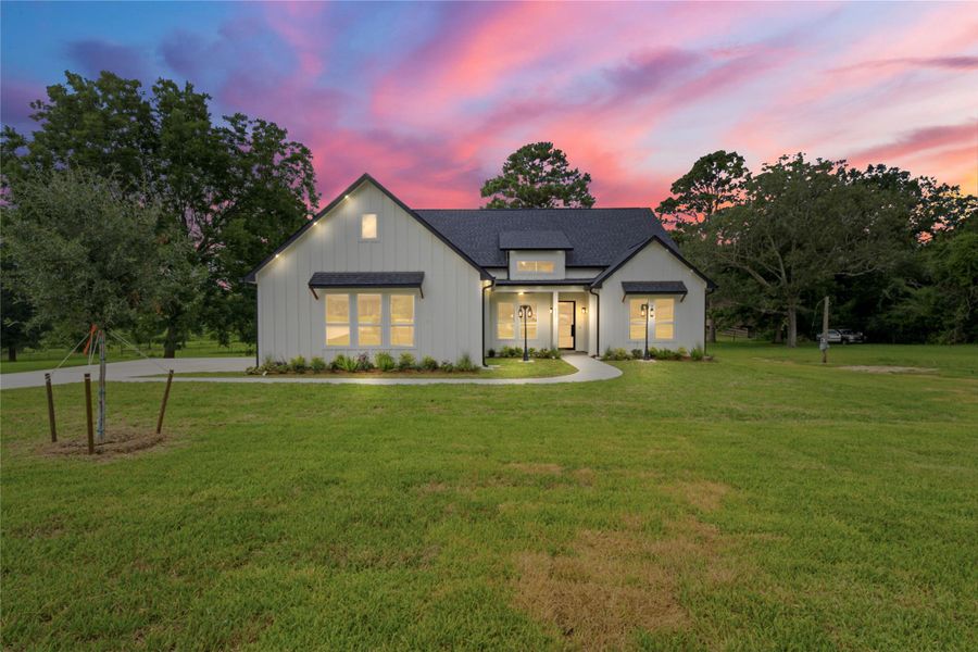 Front exterior of a new home in , Dayton, TX, highlighting curb appeal (Image 25). Front exterior of a new home in , Dayton, TX, highlighting curb appeal (Image 25).