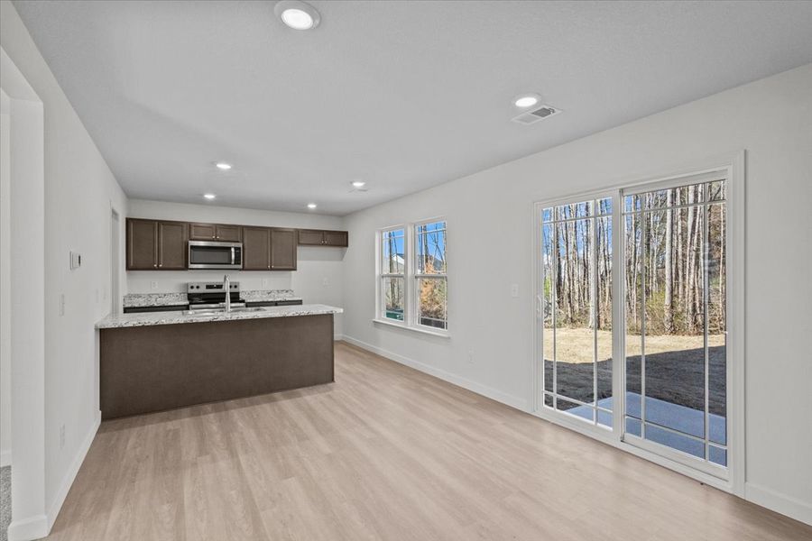 Representative furnished interior of a home built from the Roebuck by Enchanted Homes in Las Palomas Country Club Estates, La Vernia (Image 7).