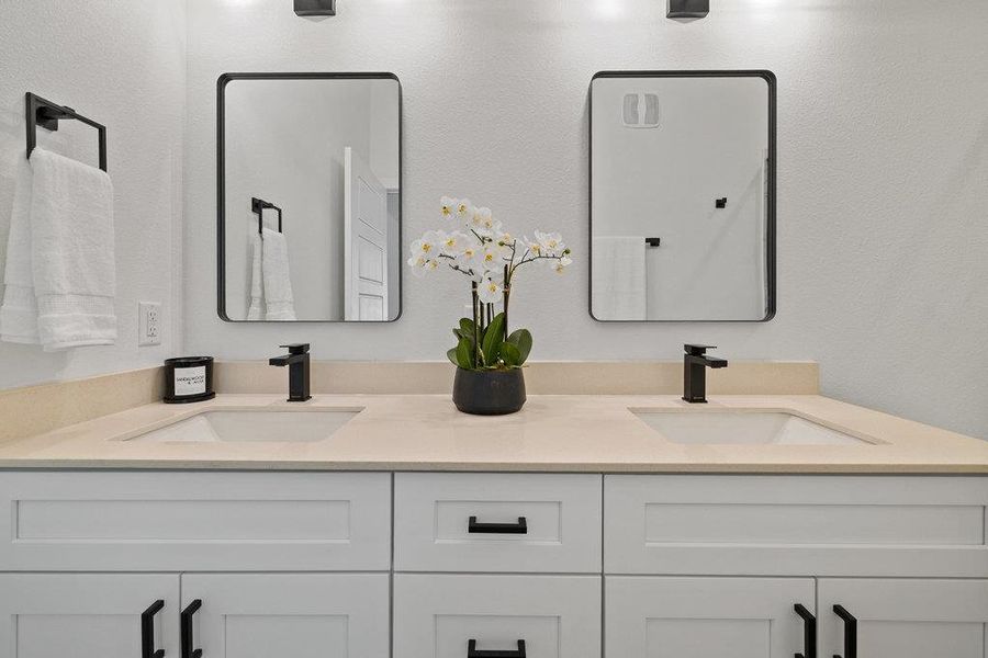 Bathroom featuring double vanity