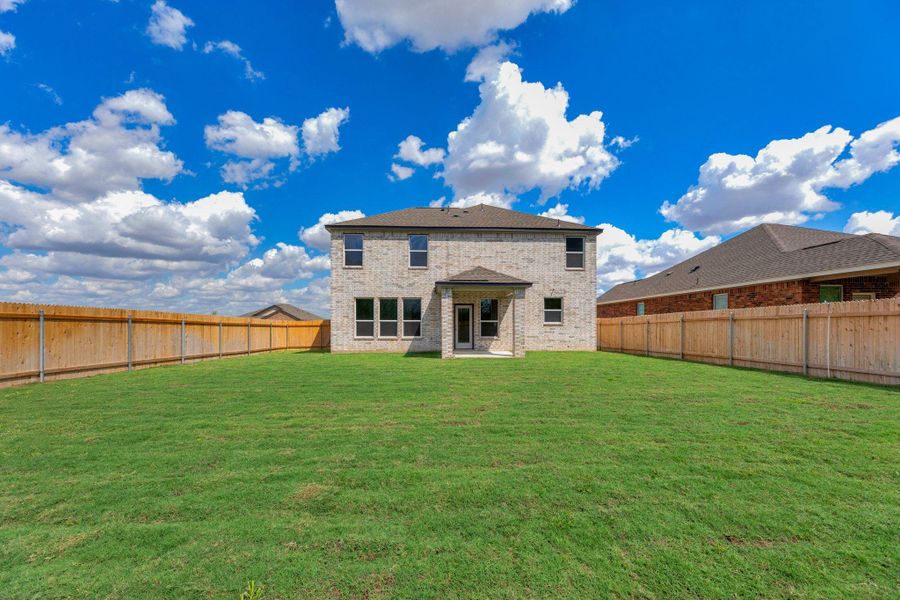 Exterior details and patio area of a home in Mustang Valley, Manor (Image 4).