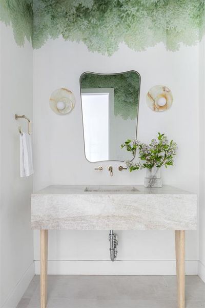 Bathroom with sink and tile patterned floors