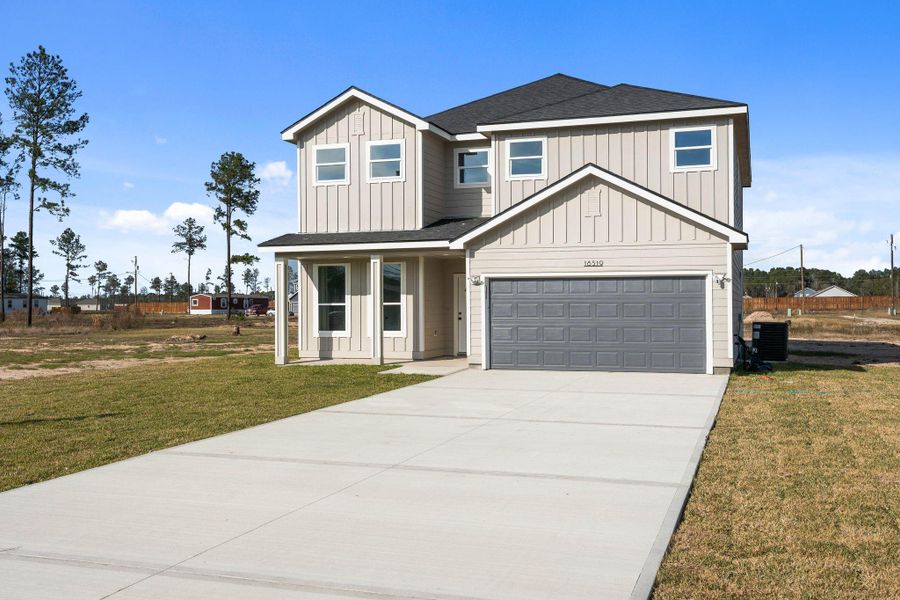 Front exterior of a new home in , Conroe, TX, highlighting curb appeal (Image 20).