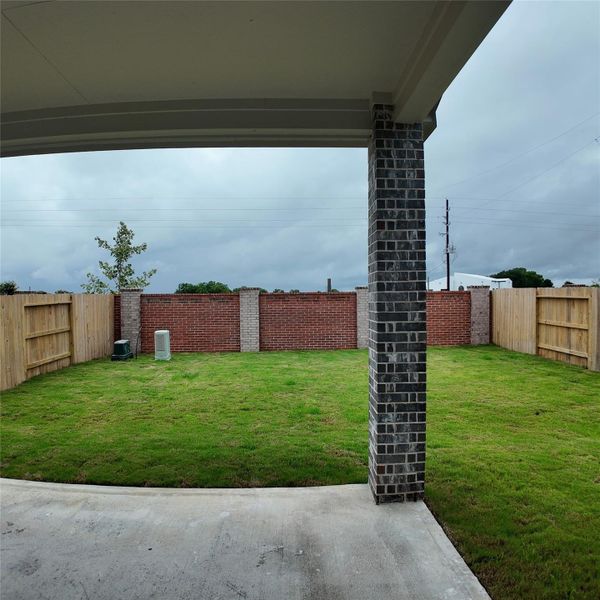 Exterior details and patio area of a home in Wildrye, Waller (Image 2). Exterior details and patio area of a home in Wildrye, Waller (Image 2).
