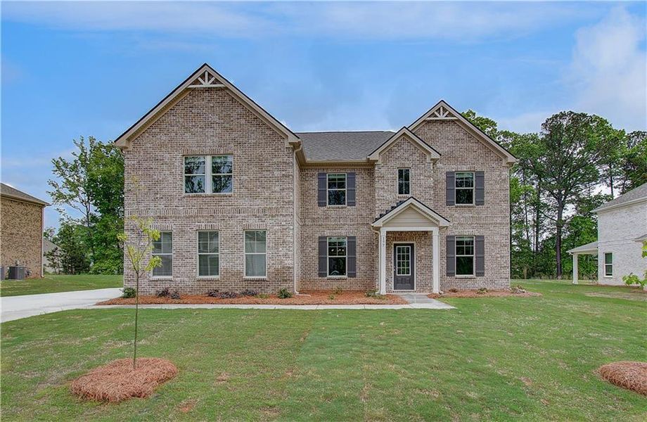 Front exterior of a new home in Cambria at Traditions, Hampton, GA, highlighting curb appeal (Image 21).