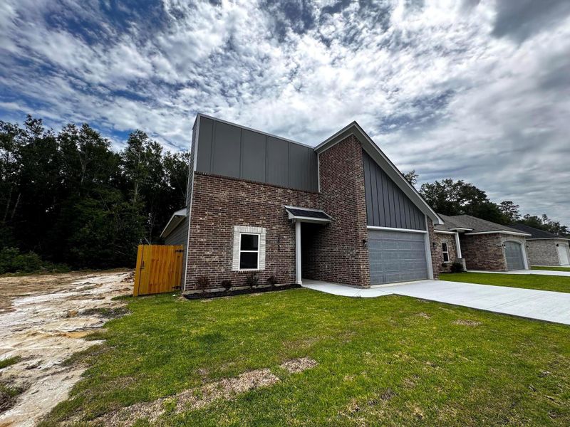 Front exterior of a new home in , Beaumont, TX, highlighting curb appeal (Image 18).