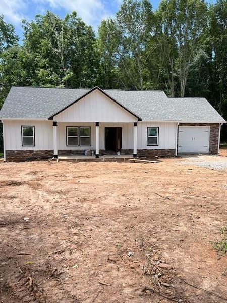 Front exterior of a new home in , Carrollton, GA, highlighting curb appeal (Image 1).