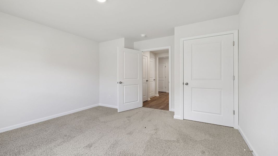 Spacious, unfurnished interior of a new home in Bentley Park, Greenwood (Image 19).