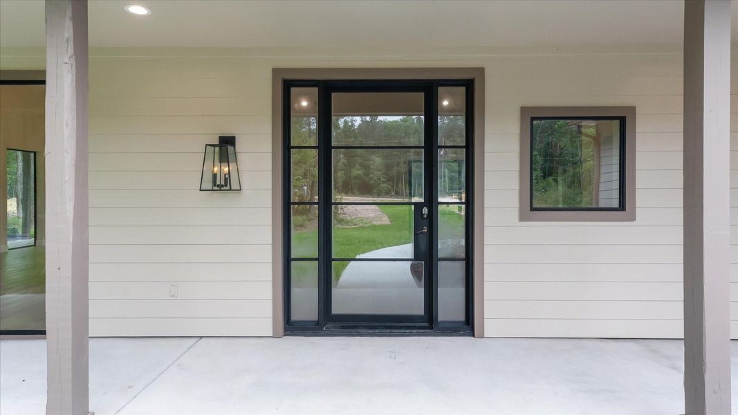 Exterior details and patio area of a home in , Conroe (Image 18).