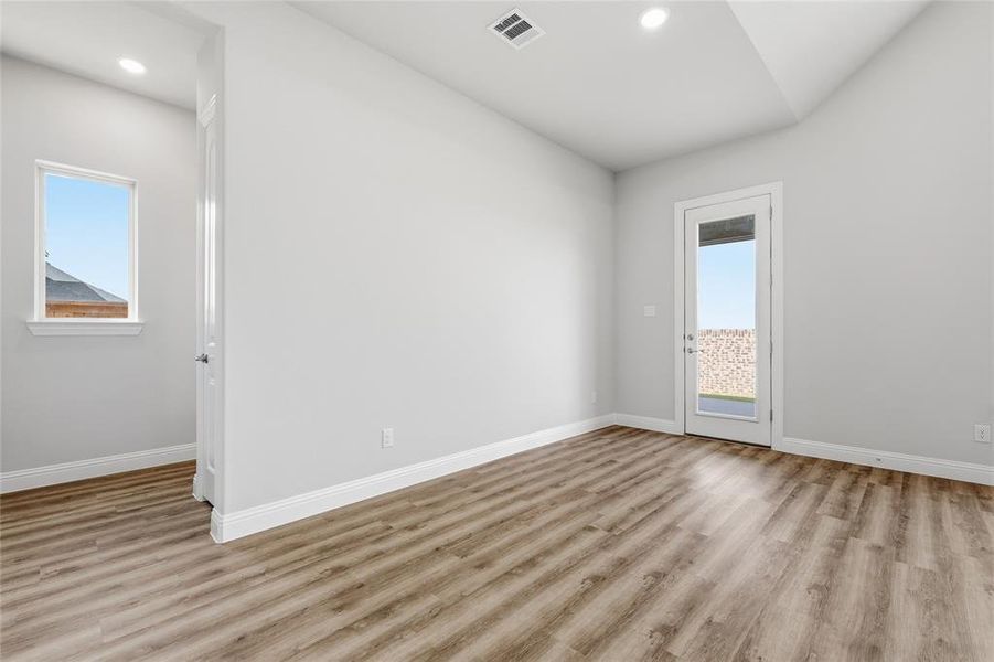 Unfurnished room with light wood-type flooring and recessed lighting Unfurnished room with light wood-type flooring and recessed lighting