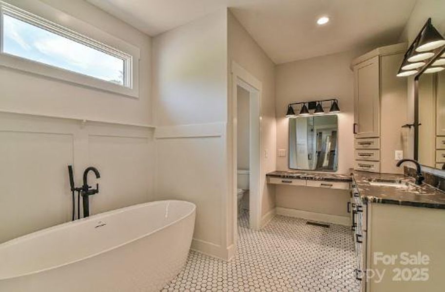 Primary Bathroom with double sinks. Similar photo.