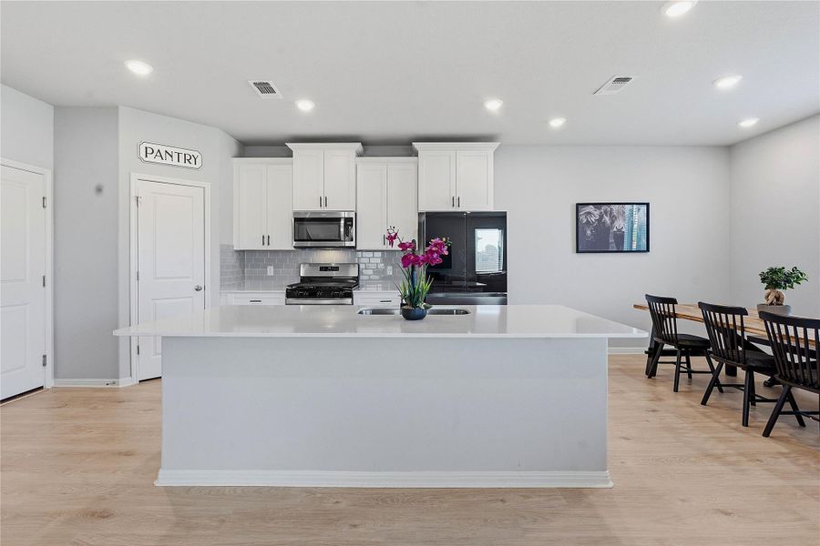Furnished interior view inside a new home in Crosswinds, Kyle (Image 7).