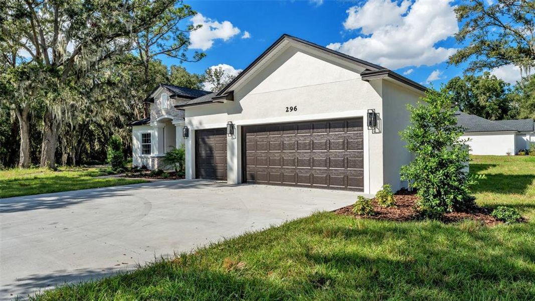 Front exterior of a new home in , Lakeland, FL, highlighting curb appeal (Image 22).