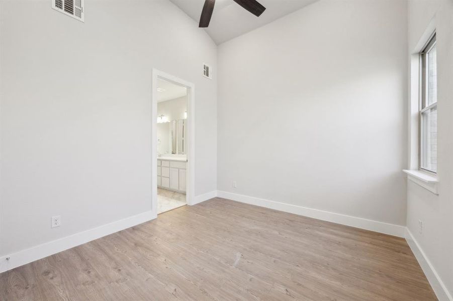 Primary Bedroom featuring ceiling fan and light hardwood / wood-style floors