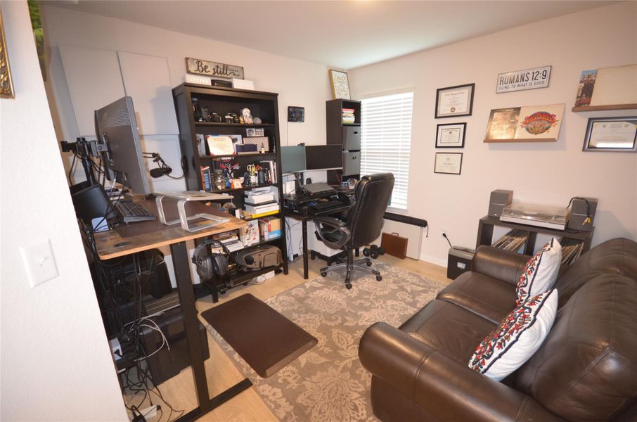 Office space featuring wood finished floors Office space featuring wood finished floors