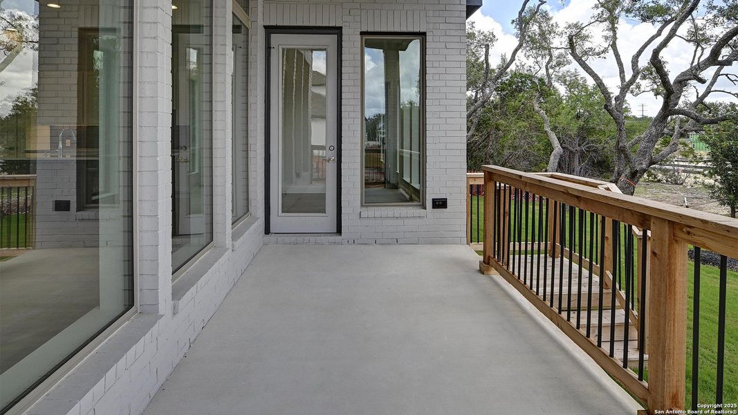Front exterior of a new home in Esperanza 60', Boerne, TX, highlighting curb appeal (Image 24).
