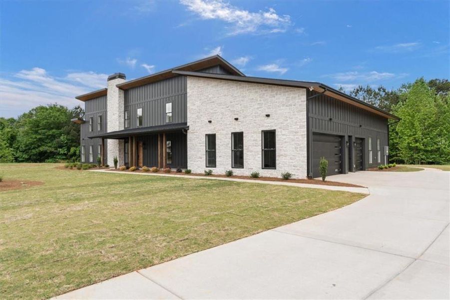 Front exterior of a new home in , Bremen, GA, highlighting curb appeal (Image 27).