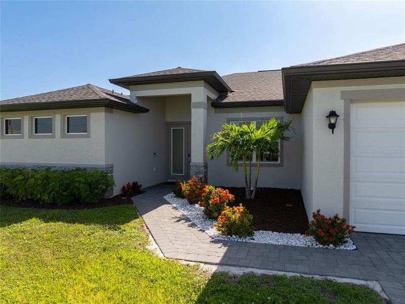 Front exterior of a new home in , Cape Coral, FL, highlighting curb appeal (Image 20).