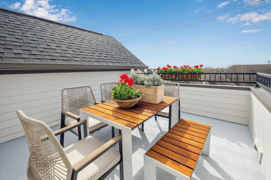 Rooftop terrace with iron railing and gas and water connection has beautiful city views.