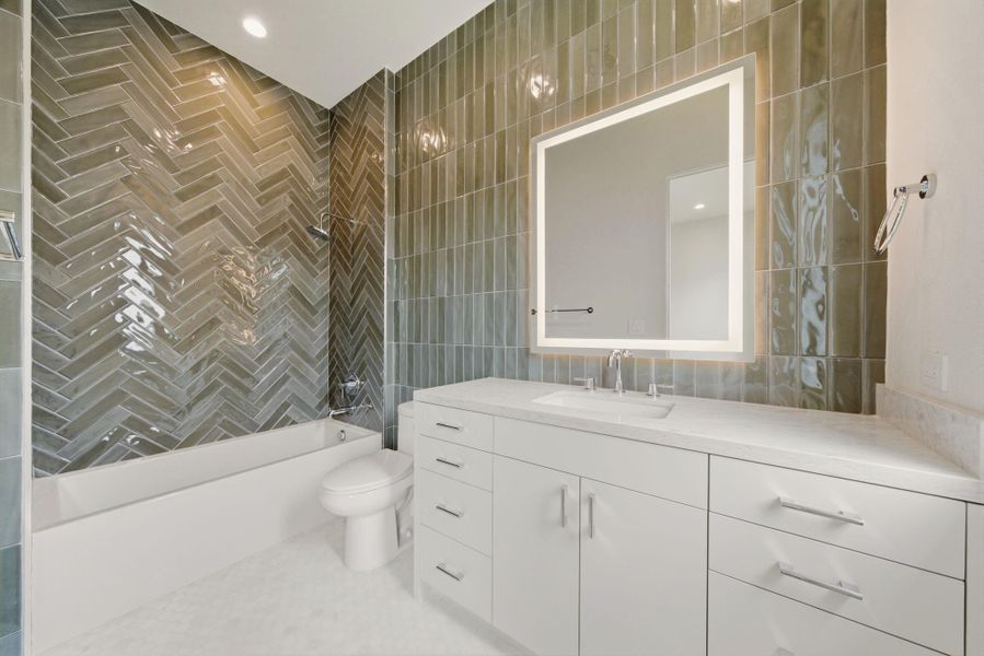 En suite bathroom with tub and shower combination.