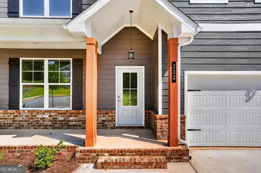 Exterior details and patio area of a home in Austin Ridge, Commerce (Image 3).