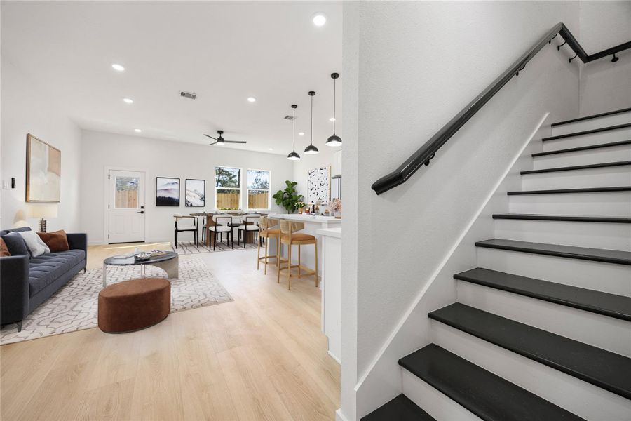 Modern staircase design featuring contrasting tread finishes, sleek handrail, and clean architectural lines, creating a stylish focal point while maximizing natural flow throughout the home. *Virtually Staged Modern staircase design featuring contrasting tread finishes, sleek handrail, and clean architectural lines, creating a stylish focal point while maximizing natural flow throughout the home. *Virtually Staged