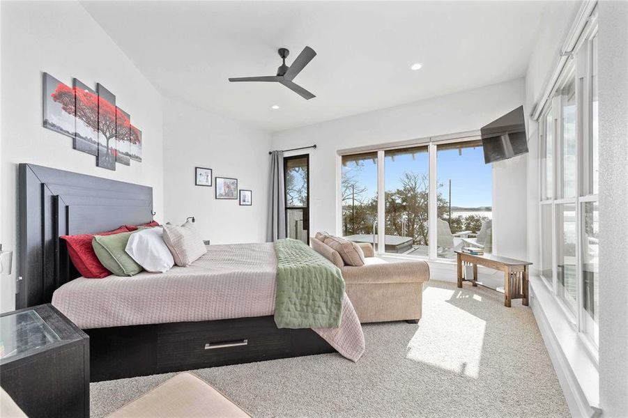 Carpeted bedroom featuring ceiling fan, recessed lighting, and access to exterior