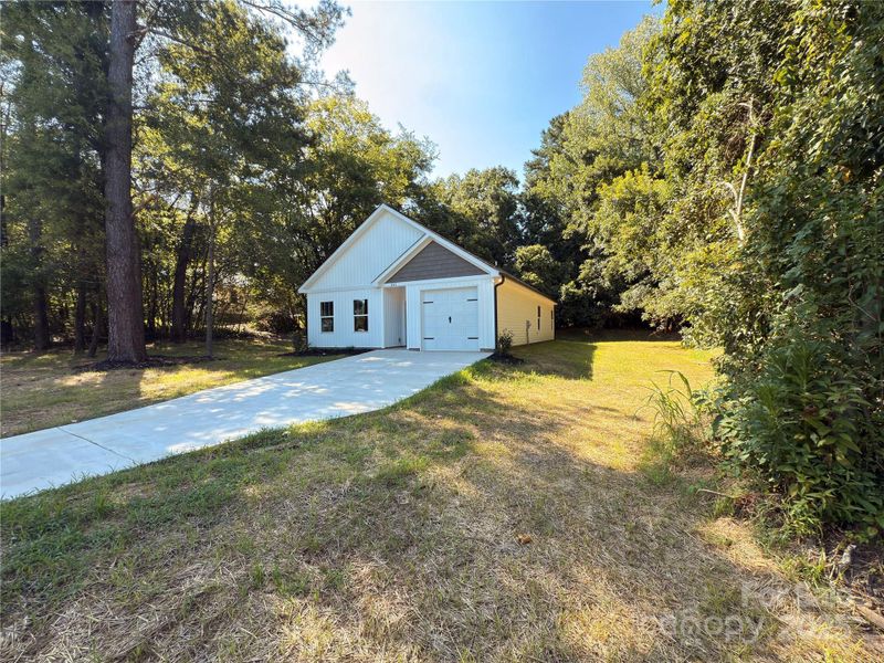 Front exterior of a new home in , Norwood, NC, highlighting curb appeal (Image 23).