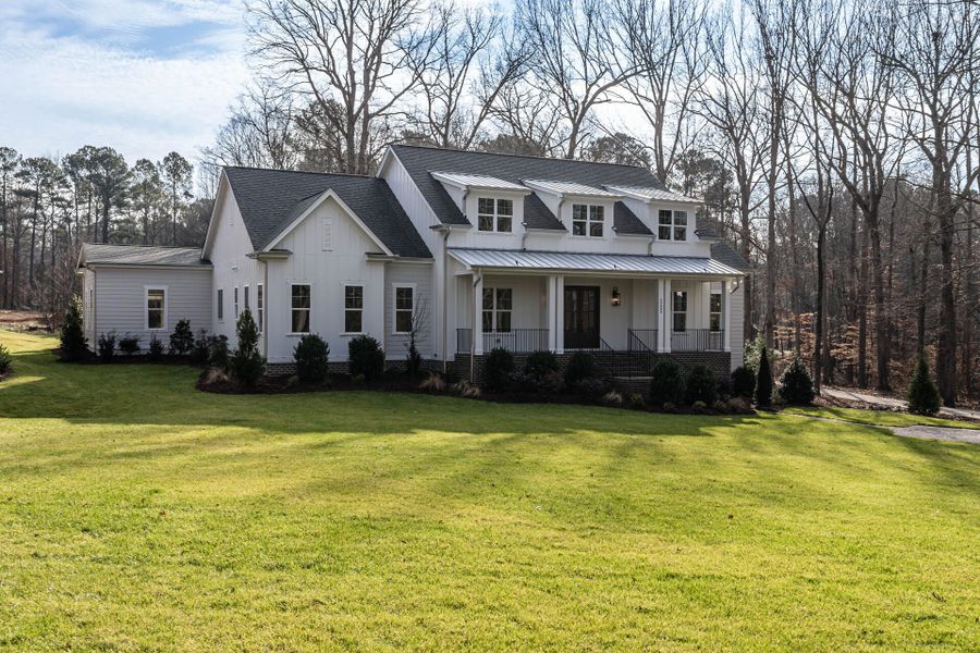 Representative exterior photo of a completed home built from the Oakmont American Farmhouse by Homes by Dickerson in Cattail, Clayton, NC (Image 11).