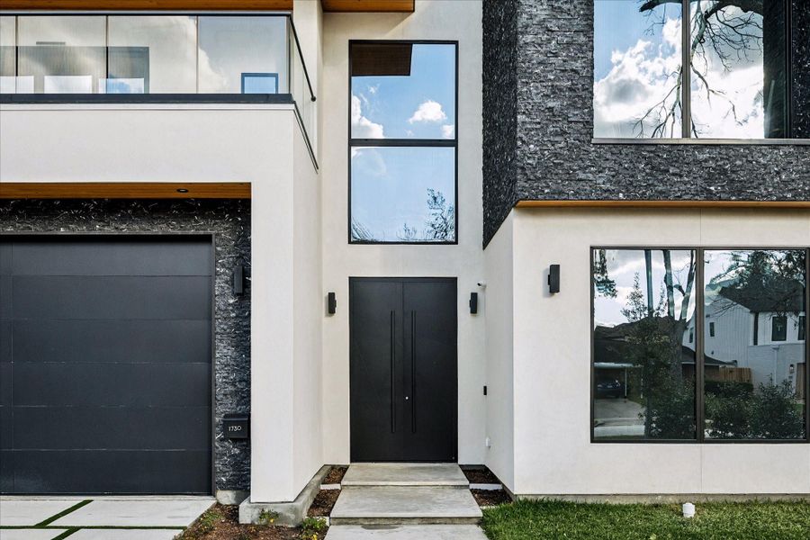 The stucco and black exterior greet you.